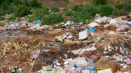 Pollution of nature, spontaneous garbage dump in the field, environmental problem of Ukraine