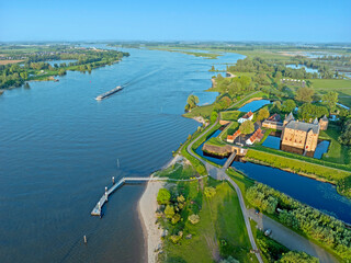 Aerial from the river Merwede with Castle Loevestein in the Netherlands