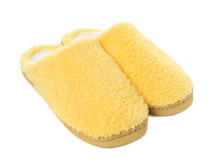 Pair of yellow soft slippers isolated on white