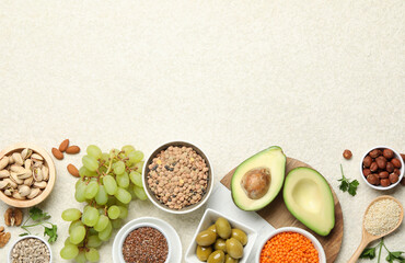 Different products high in natural fats on light table, flat lay. Space for text