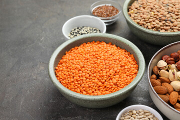 Different products high in natural fats on grey table, closeup