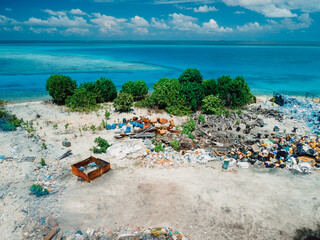 Rubbish dump and blue sea in Maldives. Ecological problem. Drone view
