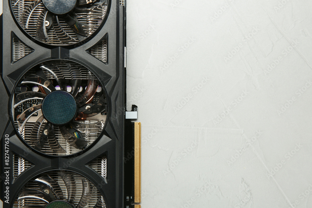 Fototapete computer graphics card on gray textured background, top view. space for text