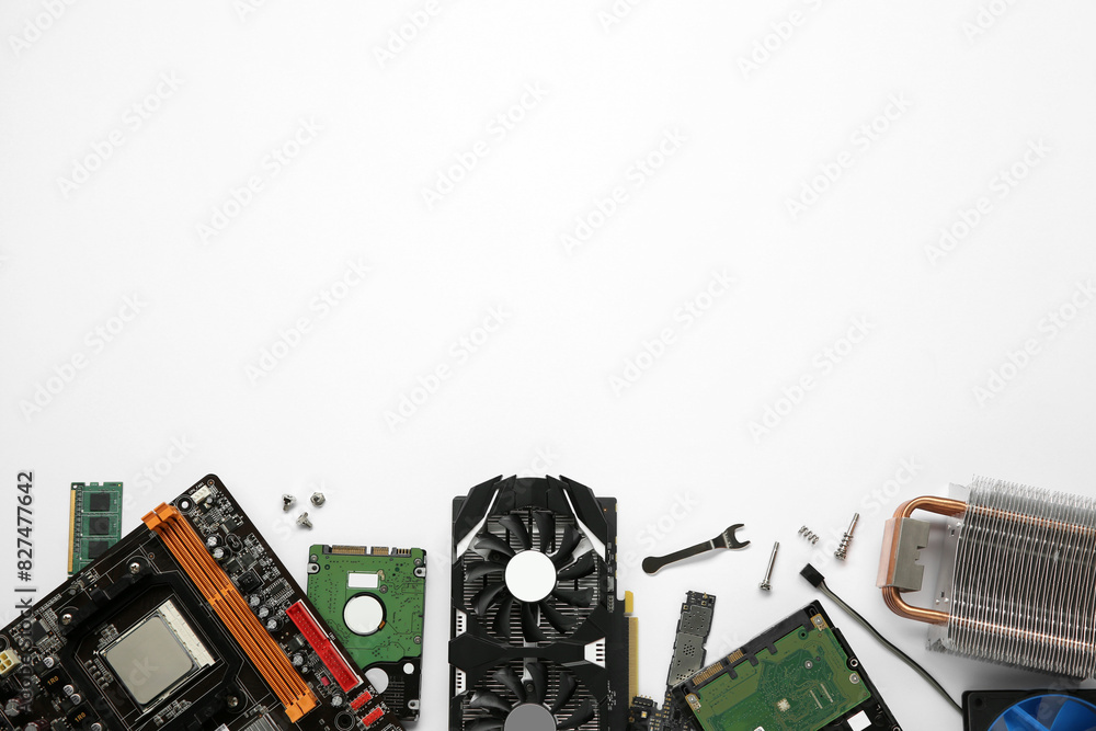 Fototapete graphics card and other computer hardware on white background, flat lay. space for text