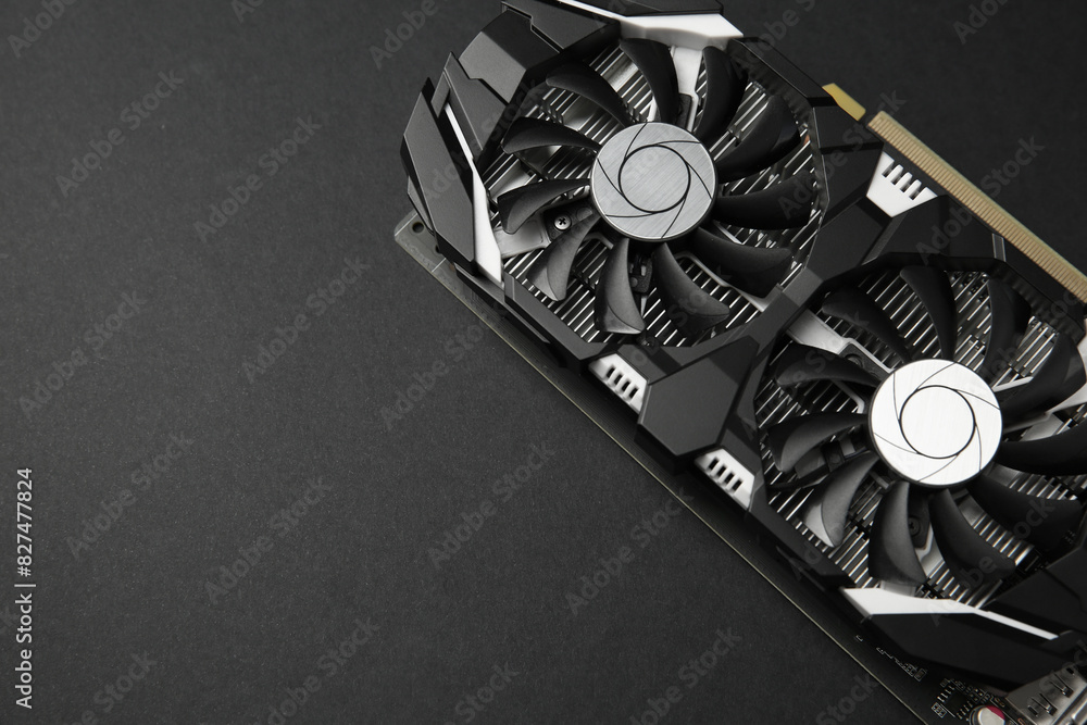 Fototapete computer graphics card on black background, top view. space for text