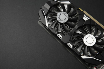 Computer graphics card on black background, top view. Space for text