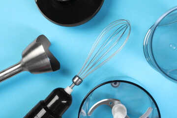 Hand blender kit on light blue background, flat lay