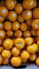 Beautiful tomatoes on a market counter during the day, healthy food, nature