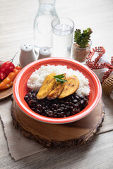 Black beans and white rice with fried plantains banana cuban venezuelan food