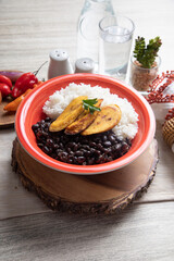 Black beans and white rice with fried plantains banana cuban venezuelan food