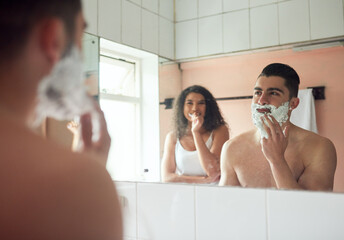 Shaving, brushing teeth and couple by mirror in bathroom for self care, grooming or morning...