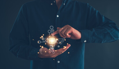 Idea innovation and inspiration concept.Hand of man holding illuminated light bulb, Idea innovation...