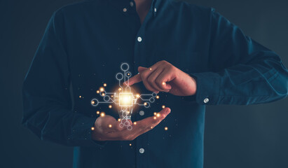 Idea innovation and inspiration concept.Hand of man holding illuminated light bulb, Idea innovation and inspiration concept.  creativity with bulbs that shine glitter, Concept for success.