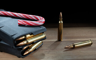 Holiday gift for an AR-15 owner with a candy cane on top of the magazines