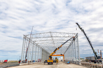 A new industrial building is installation with steel structure.