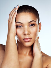 Naklejka premium Beauty, facial and portrait with natural woman in studio on white background for wellness. Aesthetic, cosmetics and glowing skin with face of confident model for dermatology or vitamin c treatment