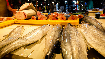 Close up of mackarel tuna in market.
Fresh seafood and fishes at the fish market. transaction in fish market.