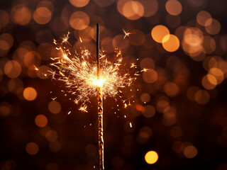 Celebratory sparkler illuminates with vibrant colors, evoking Christmas and New Year joy