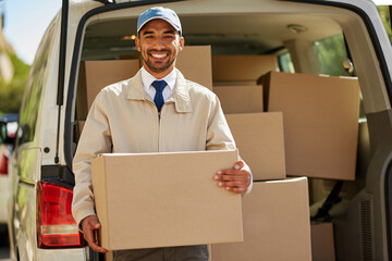 Delivery man, portrait and boxes in truck for shipping, cargo or distribution with courier. Male...
