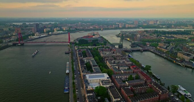 Aerial view Rotterdam, Netherlands. Willemsbrug Bridge. Noordereiland Island. View of the city center. River Nieuwe Maas. Sunset