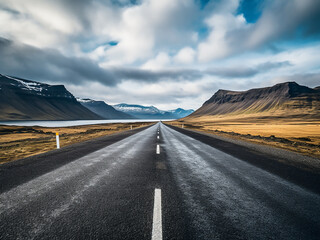 Straight Icelandic road stretches to distant horizon