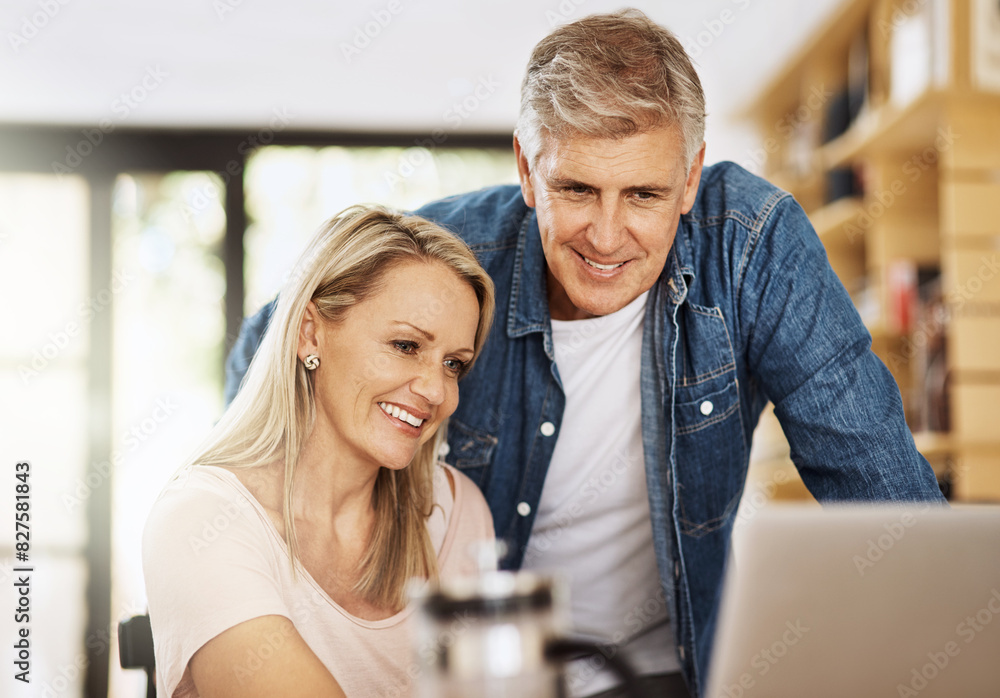 Wall mural Mature, couple and together with laptop in home for social media, happy for video call on internet app. People, house or computer with connection for online news with happiness, relax with technology