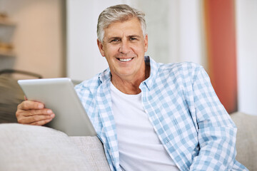 Man, portrait and tablet on sofa for social media, scroll and news report online on couch. Technology, internet and search on digital website in home, male person or living room for relax and network