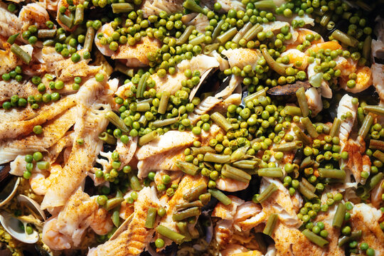 Detail of a lowcountry boil platter with peas, green beans, white fish and mussels at a wedding in Savannah, Georgia