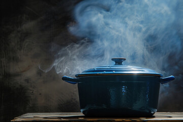 Blue Dutch Oven with Steam on Dark Background