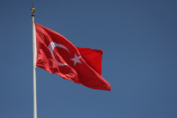 Turkish flag waving during a sunny day.