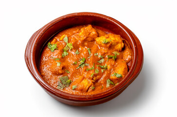 a plate of chicken curry isolated on white table from above