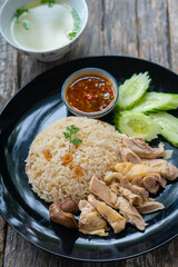 Steamed rice and chicken, served with soup and various sauce.