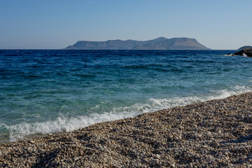 Beautiful coast stony beach at summer . Greece.