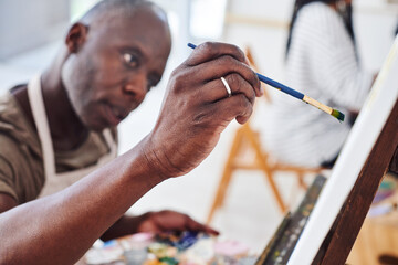 Artist, mature or black man painting on canvas or easel for therapy, drawing or studio project....