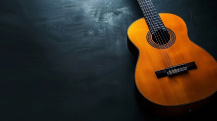 Naklejka premium Acoustic guitar on a black background (with copy space)