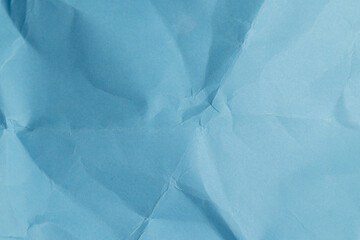 a piece of crumpled blue paper