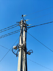 Concrete pillars with electrical wires, coils of cables and switching equipment. Electricity...