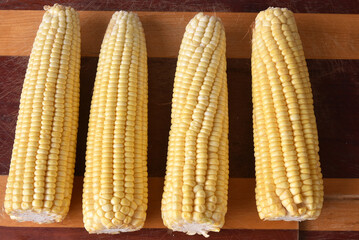 corn natural food healthy delicious vegan cooked green corn on wooden table
