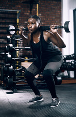 Black woman, squat and barbell for fitness, training and confidence for sports workout. Weights,...