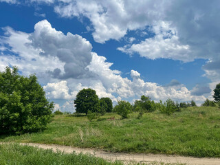 Beautiful landscape. Summer. Sky with clouds. Walk.
