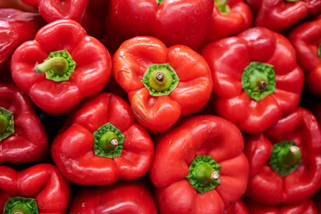 Group of stacked red bell peppers