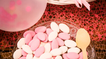 Plate of white and pink confetti for wedding or baptism