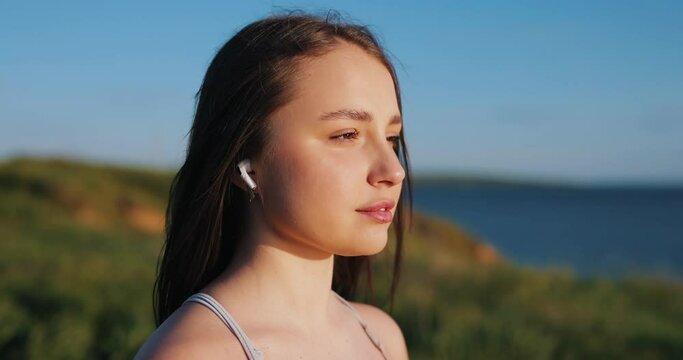 Slow motion pretty woman opening eyes at the nature