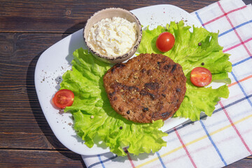 Balkan cuisine. Pljeskavica,  grilled minced meat dish.  Kajmak,  milk cream