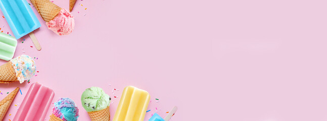 Collection of colorful pastel summer ice cream cones and popsicle frozen desserts. Overhead view corner border on a pink banner background. Copy space.