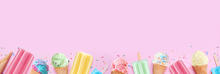 Variety of colorful pastel summer ice cream cones and popsicle frozen desserts. Top view bottom...