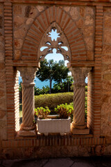 Colomares castle sea landscape throught the window. Monument, in the form of a castle, dedicated to the life and adventures of Christopher Columbus. It was built near Benalmádena in Spain.