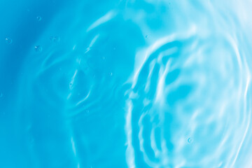 Macro blue water surface,Blur​ abstract​ of​ surface​ blue​ water. Abstract​ of​ surface​ blue​ water​ reflected​ with​ sunlight​ for​ background. Blue​ sea. Blue​ water.​ Water​ splashed​ use​