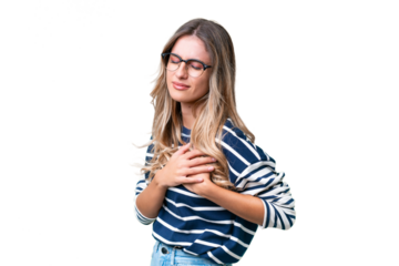 Young Uruguayan woman over isolated background having a pain in the heart