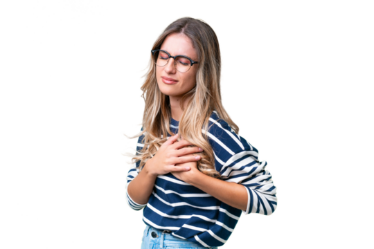 Young Uruguayan woman over isolated background having a pain in the heart
